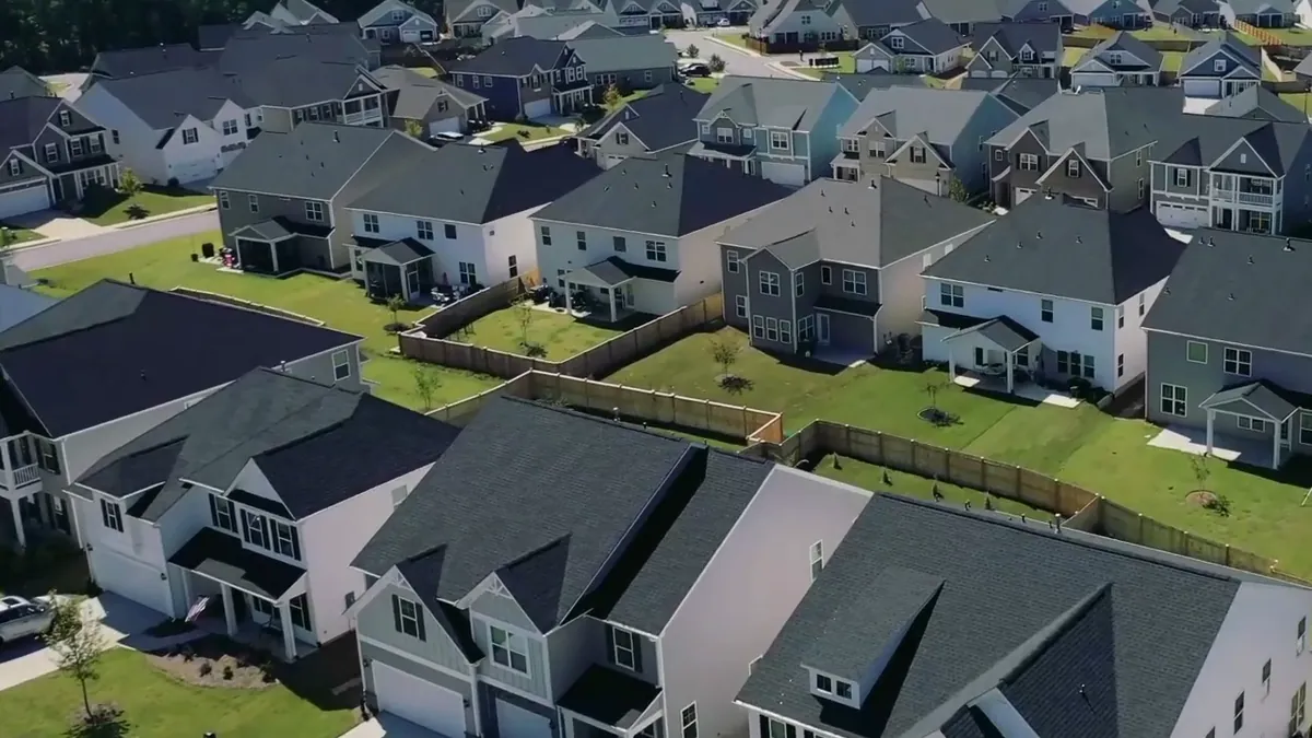 A street of finished two-story homes from the air